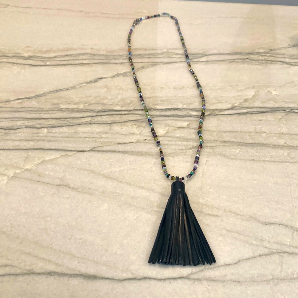 Multi color beaded necklace with leather tasssl